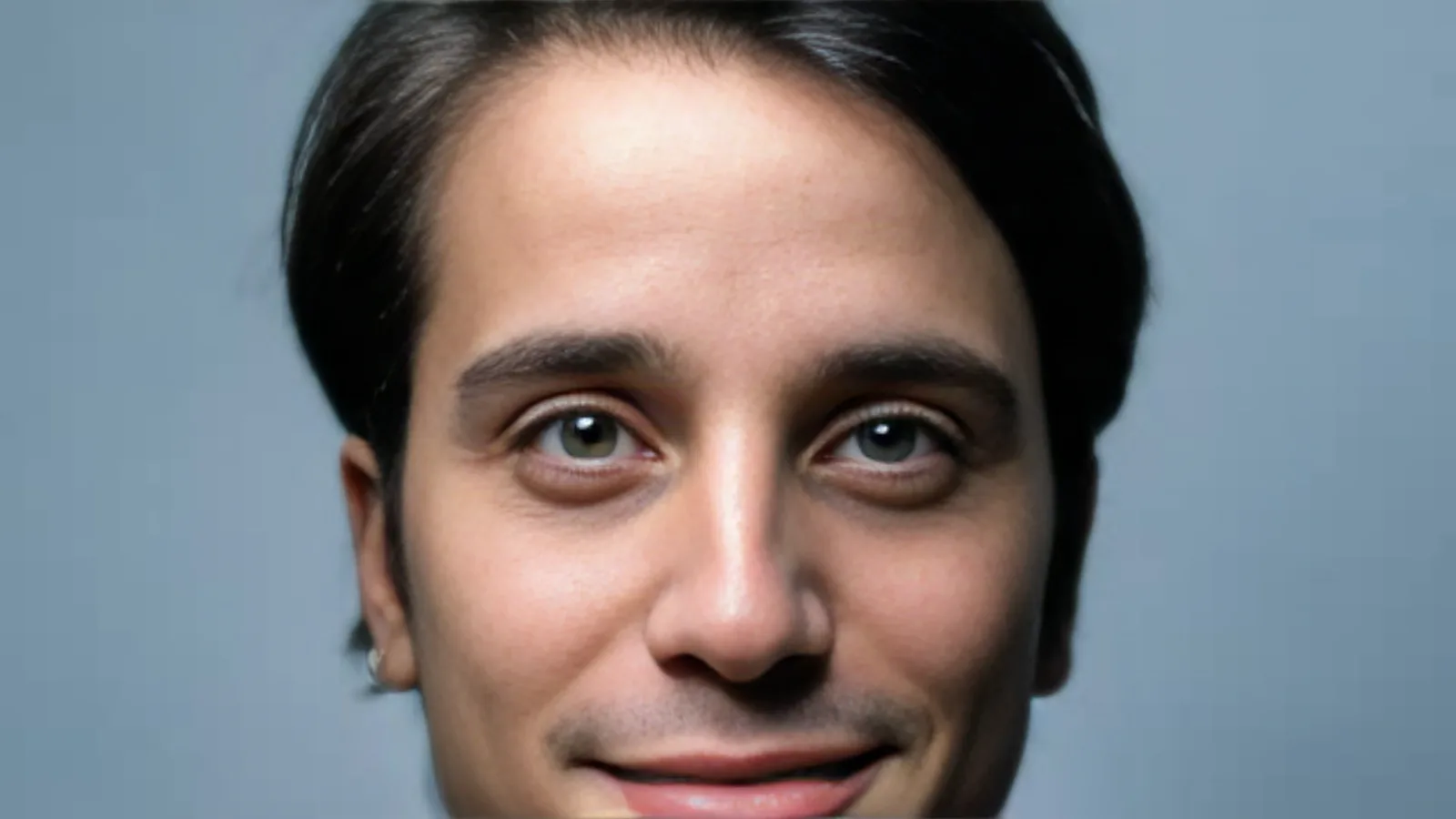 After: Soft, out-of-focus close-up of a man restored to a sharp portrait