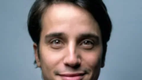 Before: Soft, out-of-focus close-up of a man restored to a sharp portrait