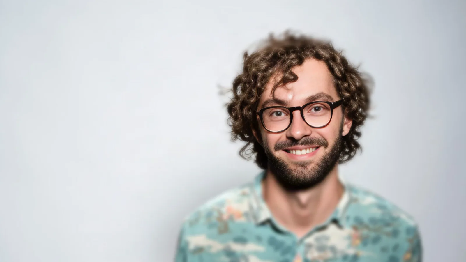Out-of-focus portrait of a man with glasses brought back into focus — After