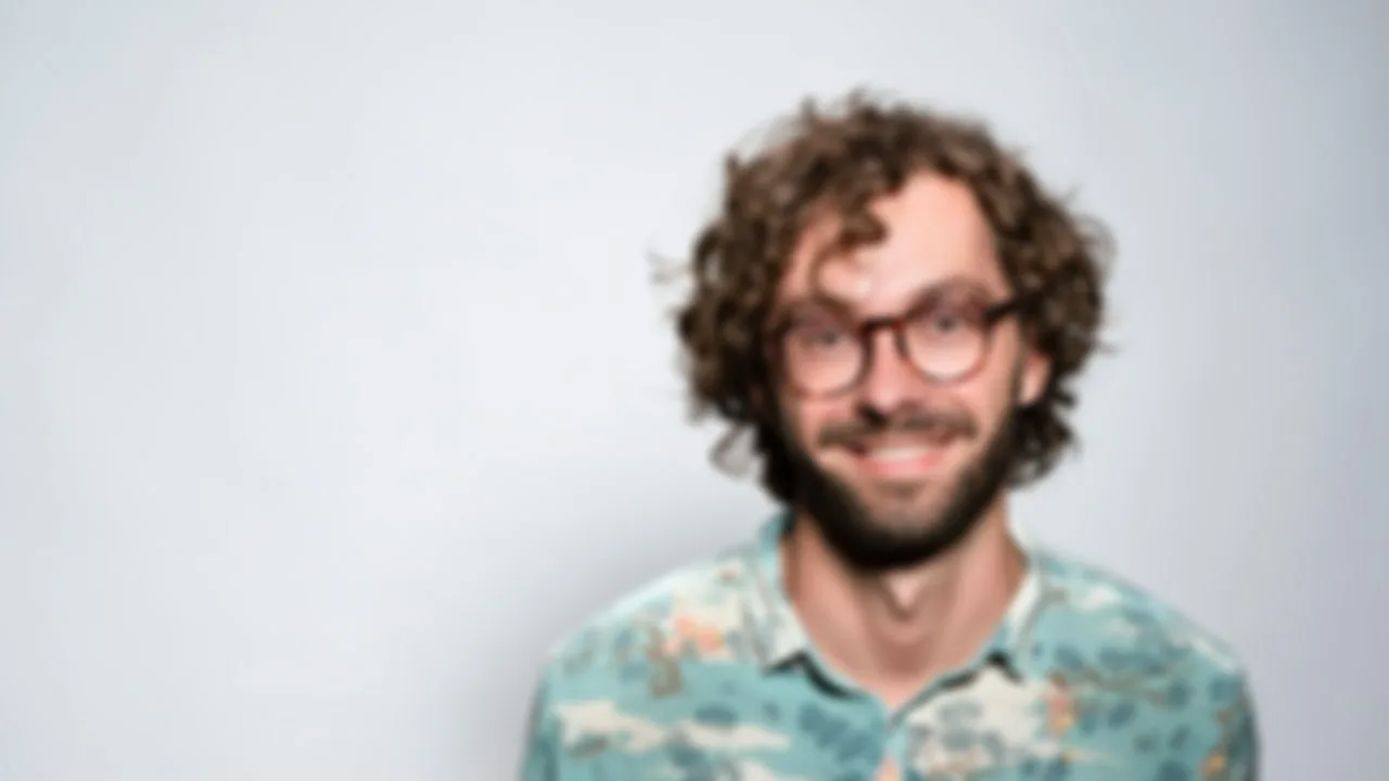 Out-of-focus portrait of a man with glasses brought back into focus — Before